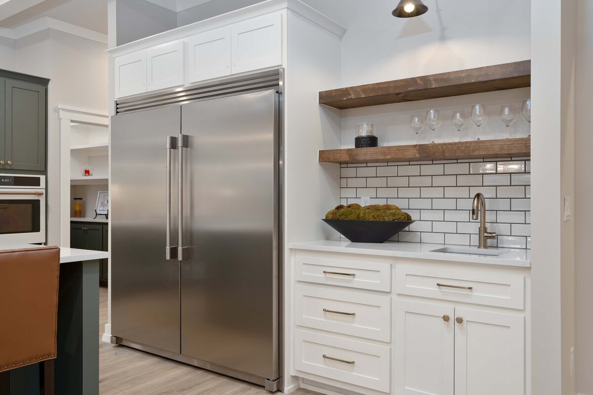 16 Side by side fridge Floating shelves stained Tulsa Kitchen Boulevard Interiors