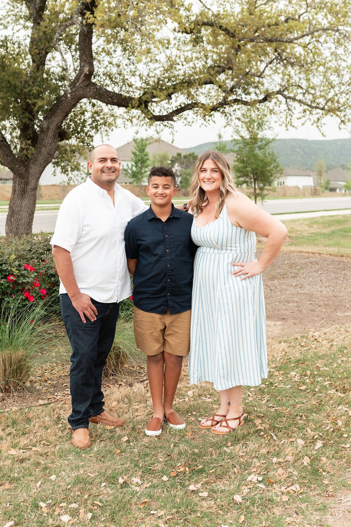 Jen, Miguel, and Deacon during a family photoshoot in Austin