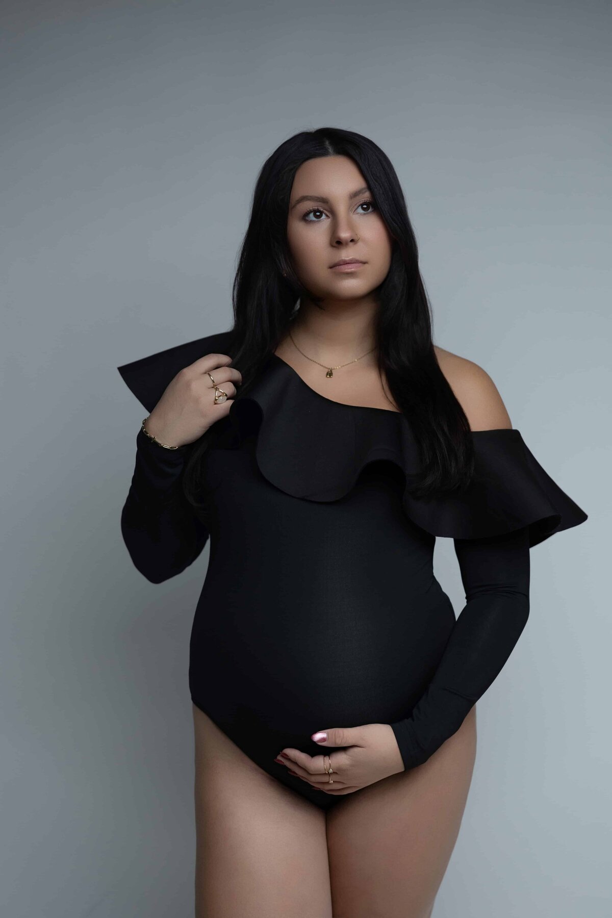 pregnant mom in studio looking into the light