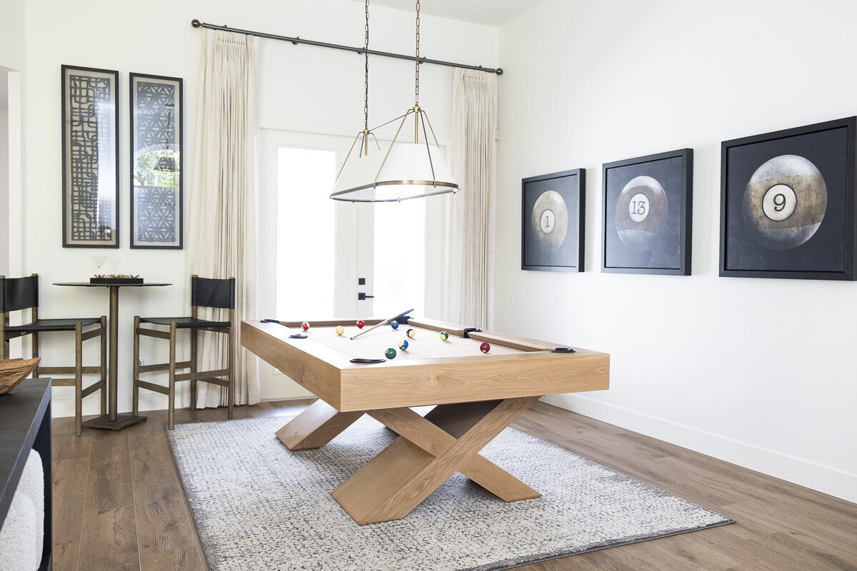 dewine design interiors belle isle project pool table with white doors and off white curtains
