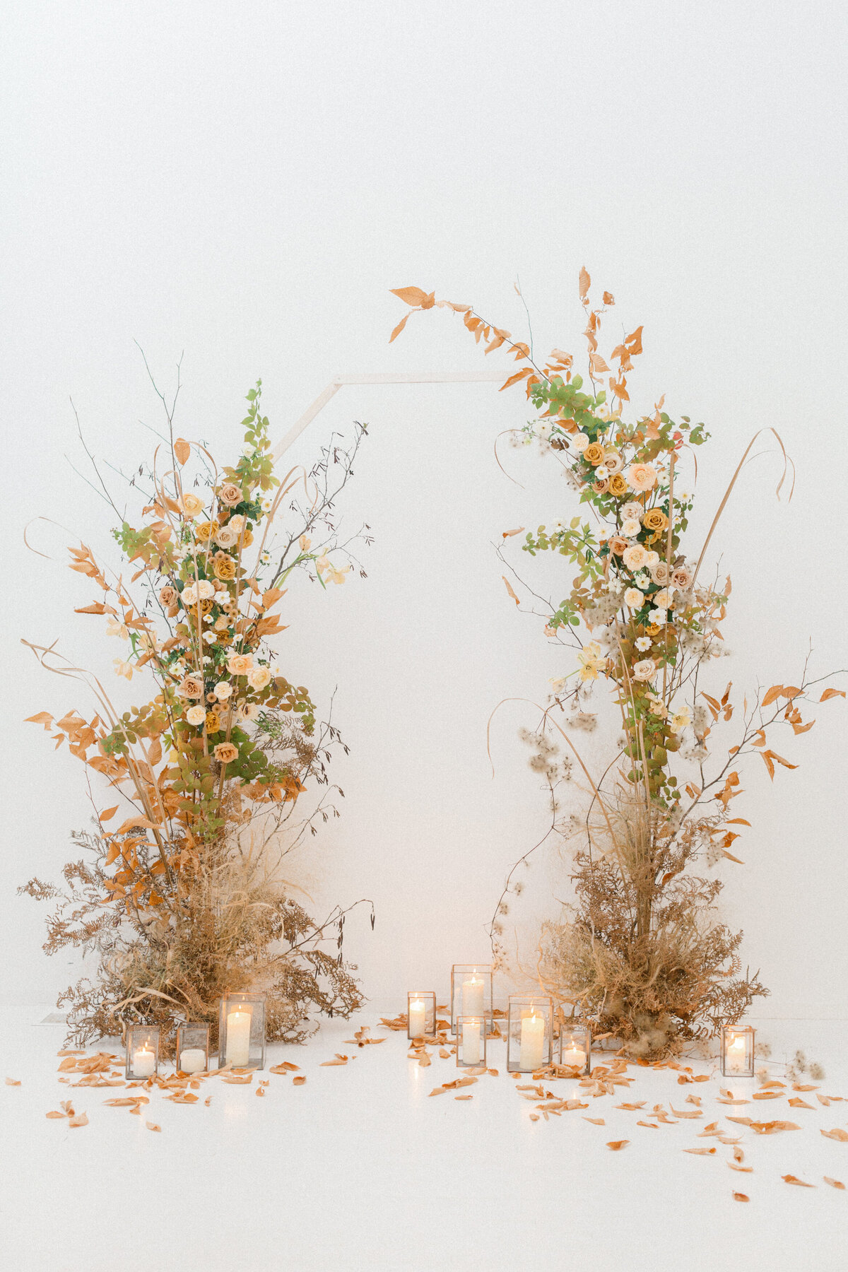 Two standing ceremony arrangements of whimsical, organic autumn flowers for a Montreal wedding.