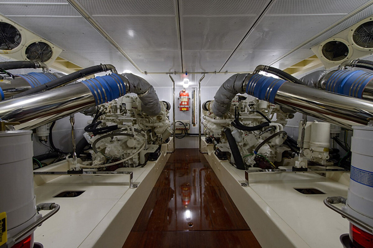 clean and well-lit engine room with two large engines positioned on either side