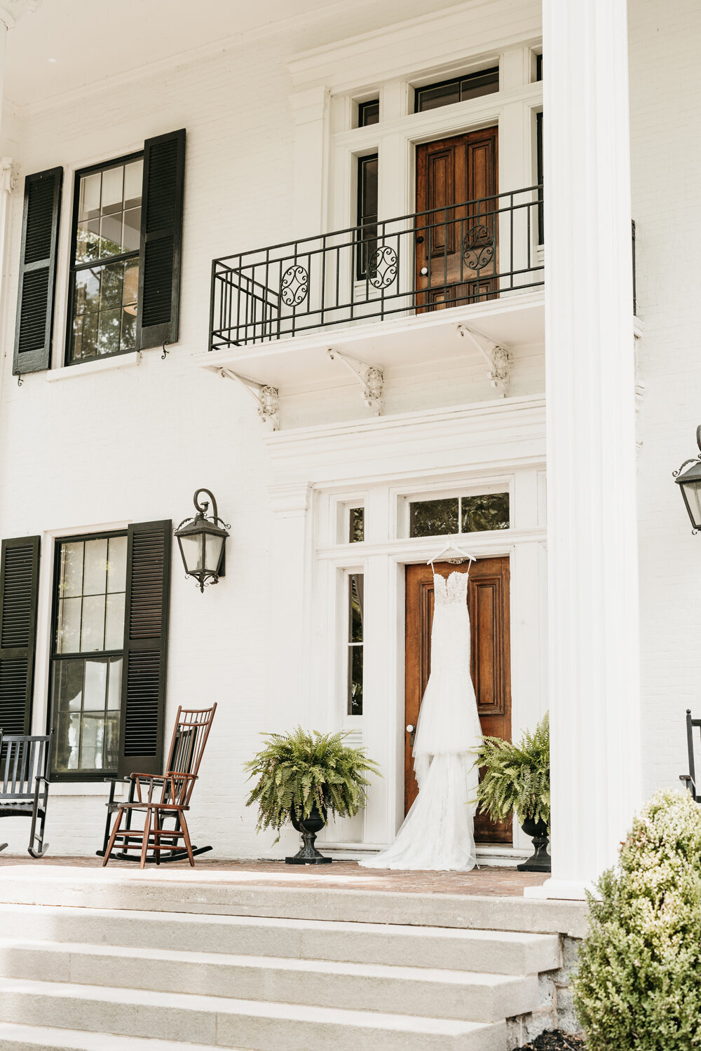 Elegant bridal gown hanging on the front door of Ashford Acres Inn, Cynthiana, KY