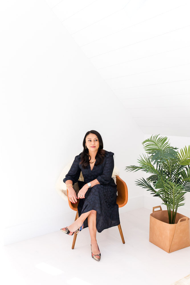 Female entrepreneur headshot with plant