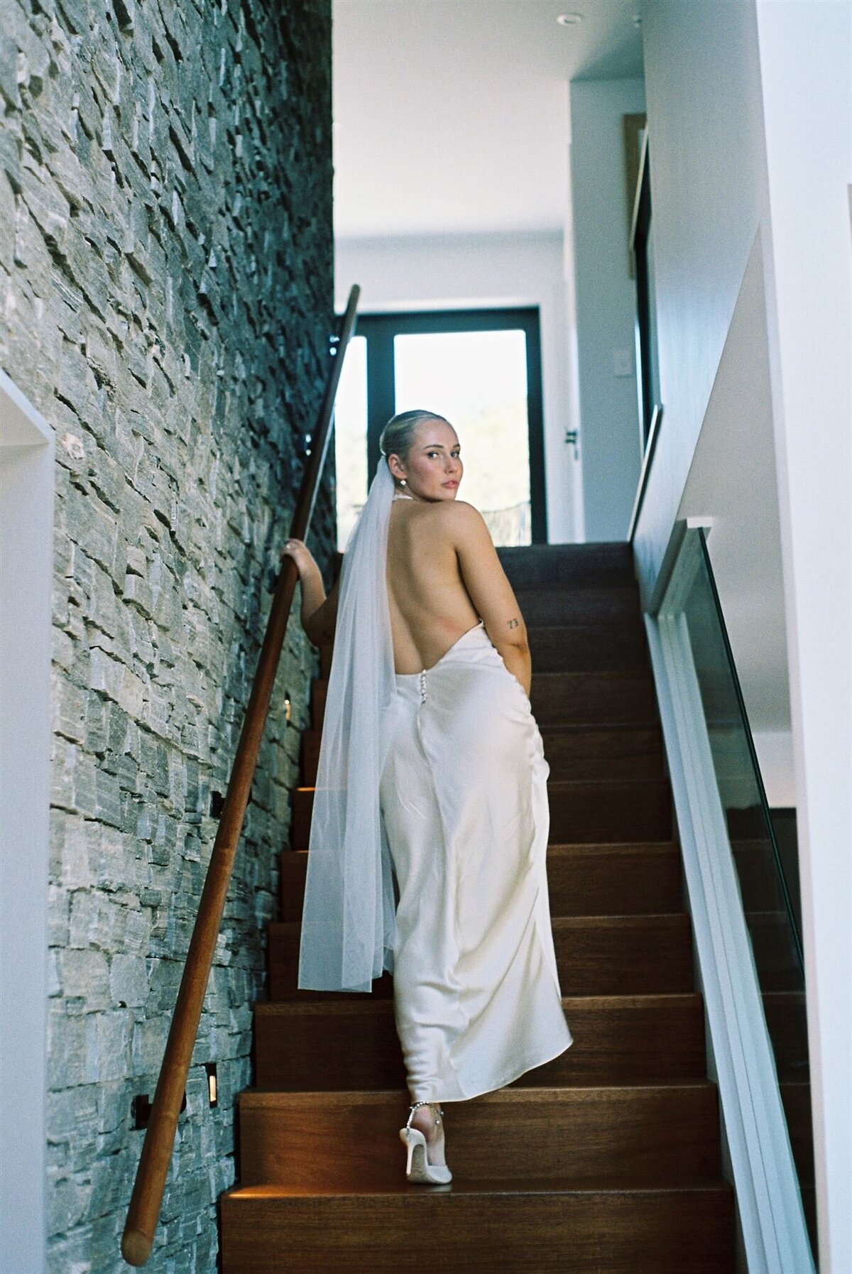 bride-on-stairs-wedding-dress-stunning-elegant