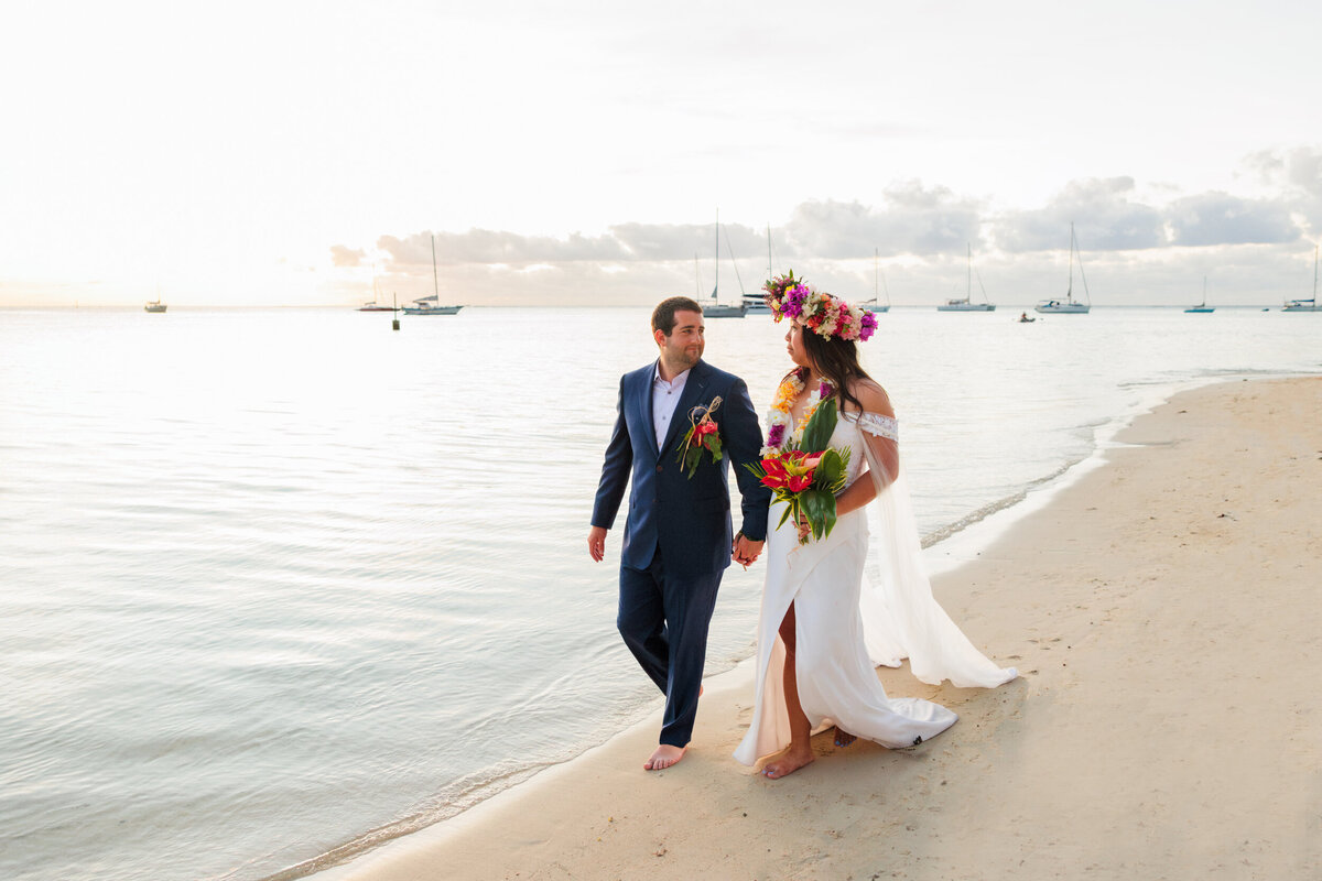 bride-and-groom-walking-tahiti-beach