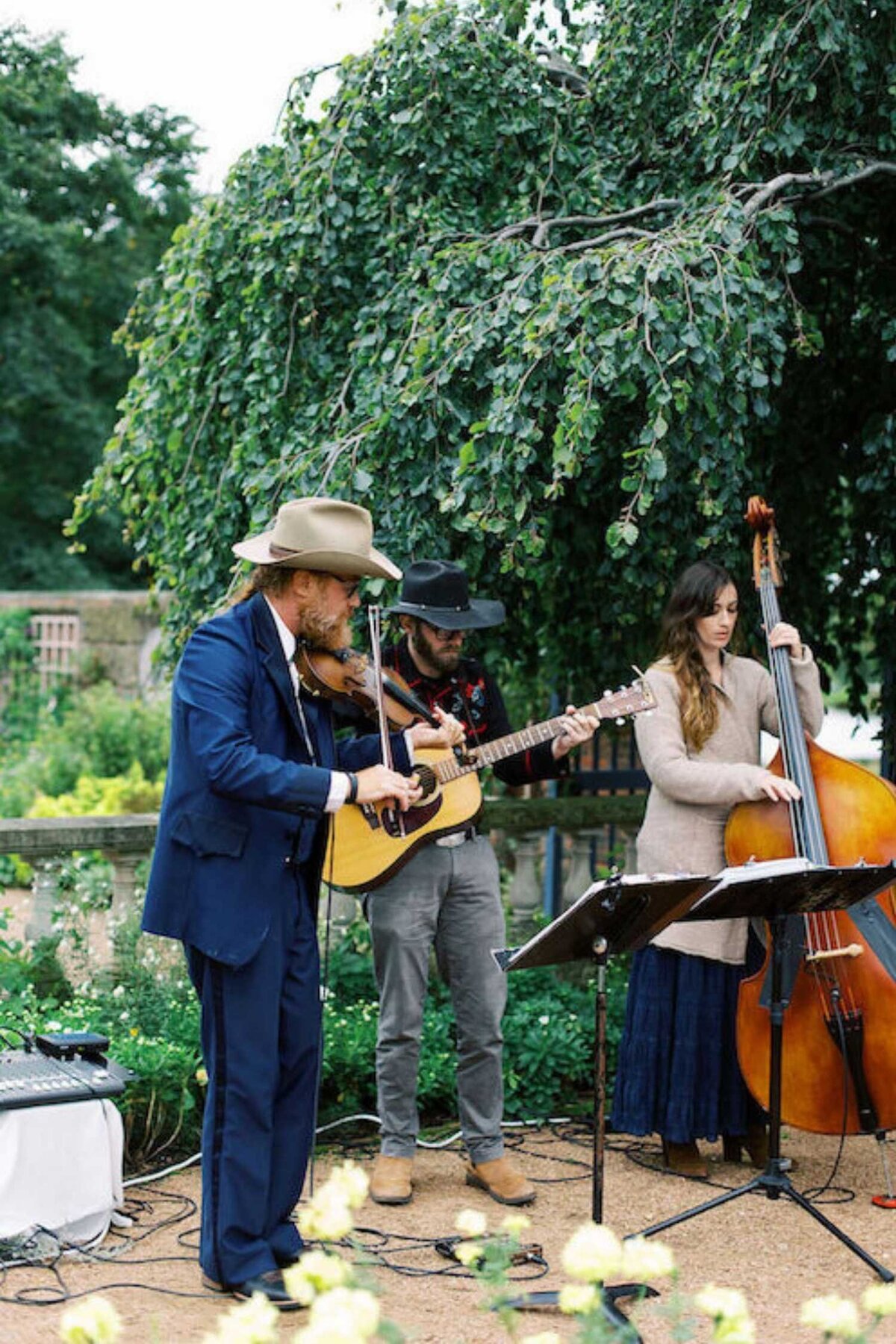 Bluegrass band plays before the ceremony at a luxury Chicago outdoor garden wedding.