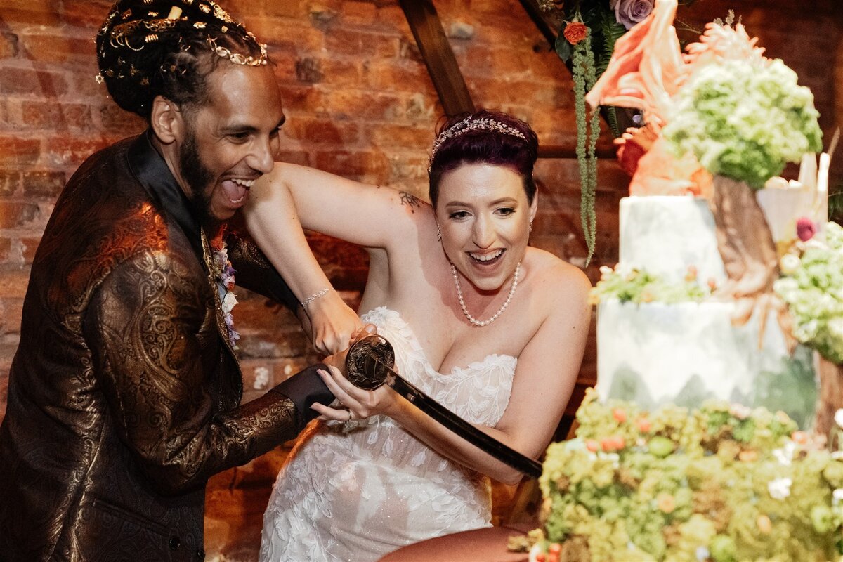 44 - Armature Works The Gathering Wedding Reception Cake Cutting with Sword - Tampa Bay Wedding Planner