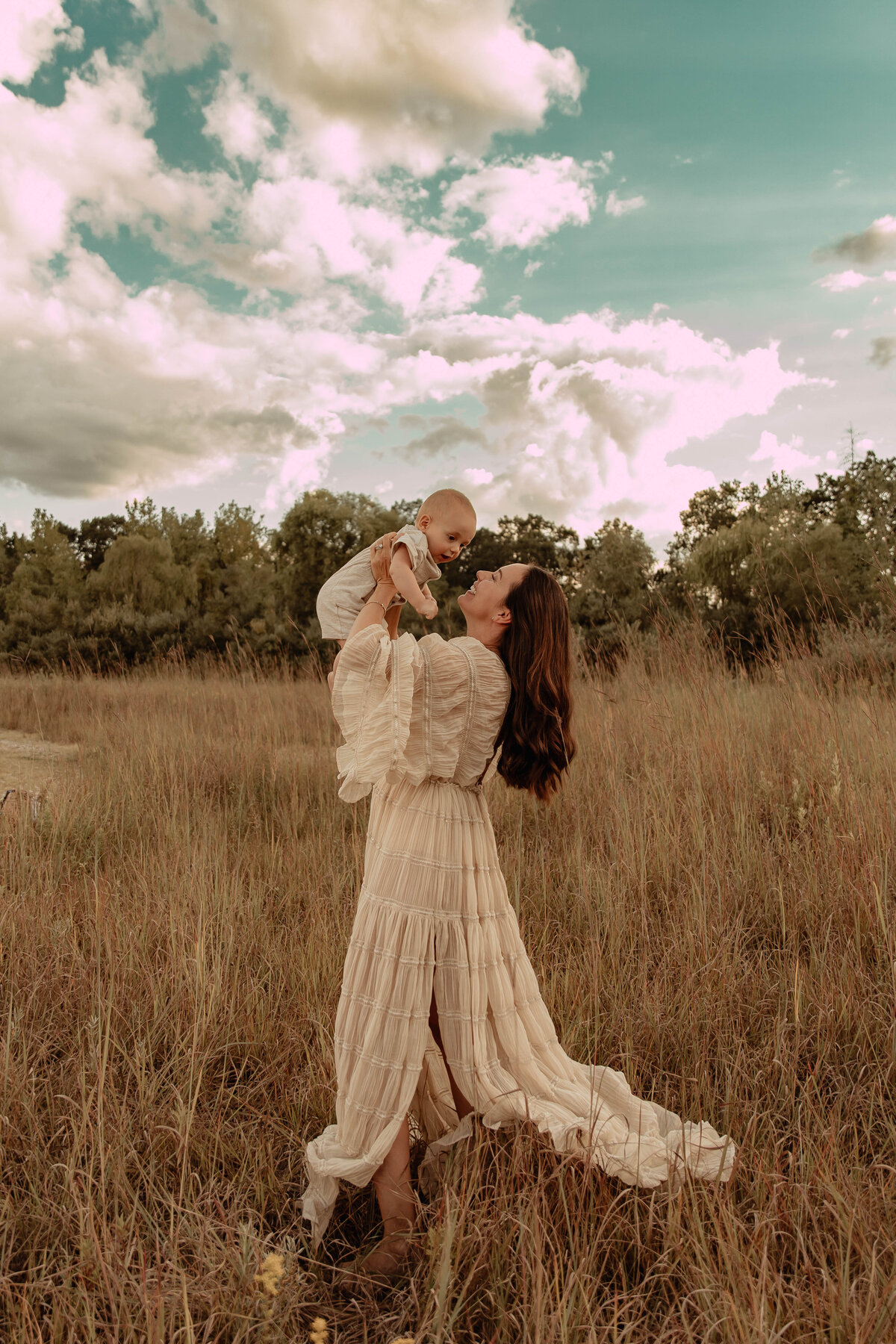 A mother and her baby posing for a photo in a field in North, New Jersey