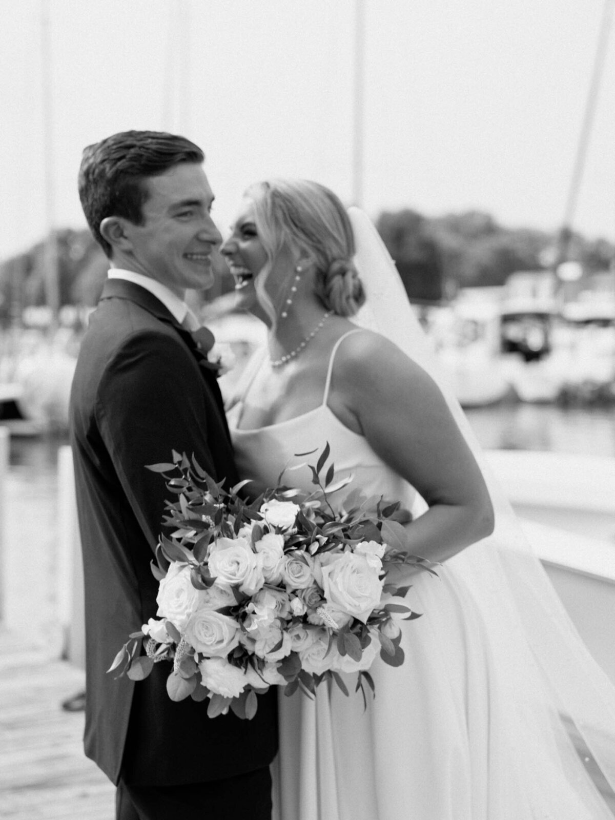 Bride and groom by the water at Cleveland Yachting Club