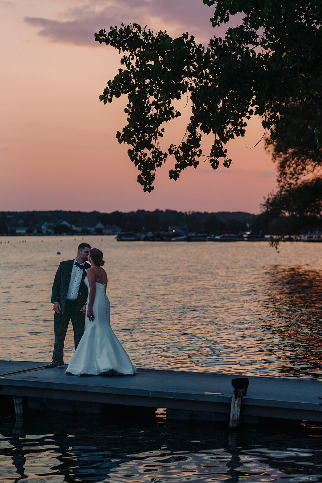 Bride and groom on the dock at sunset at Canandaigua Country Club, NY