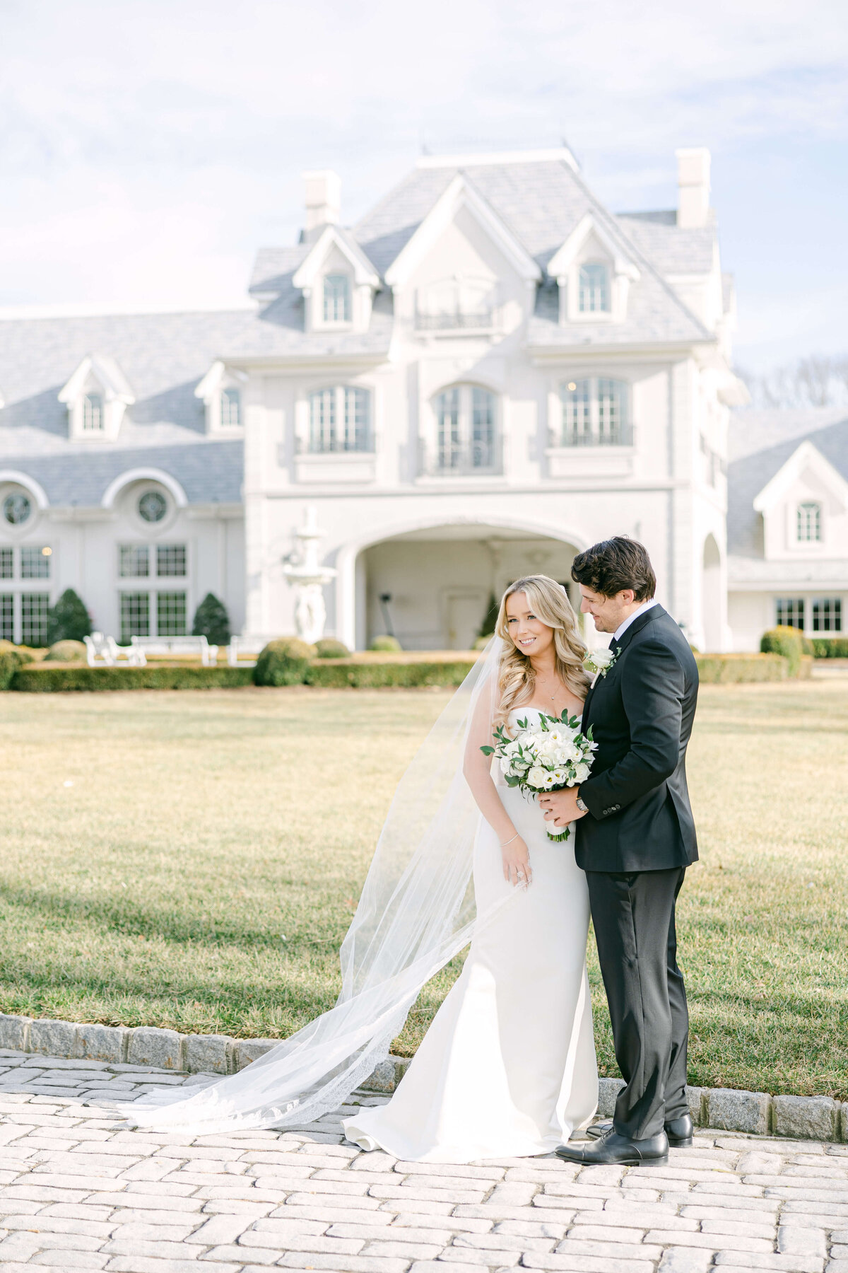 bride and groom out front of park chateau estate and gardens