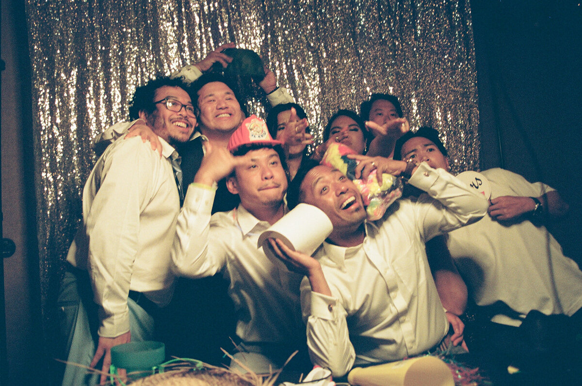 friends at a Photo Booth at the wedding reception