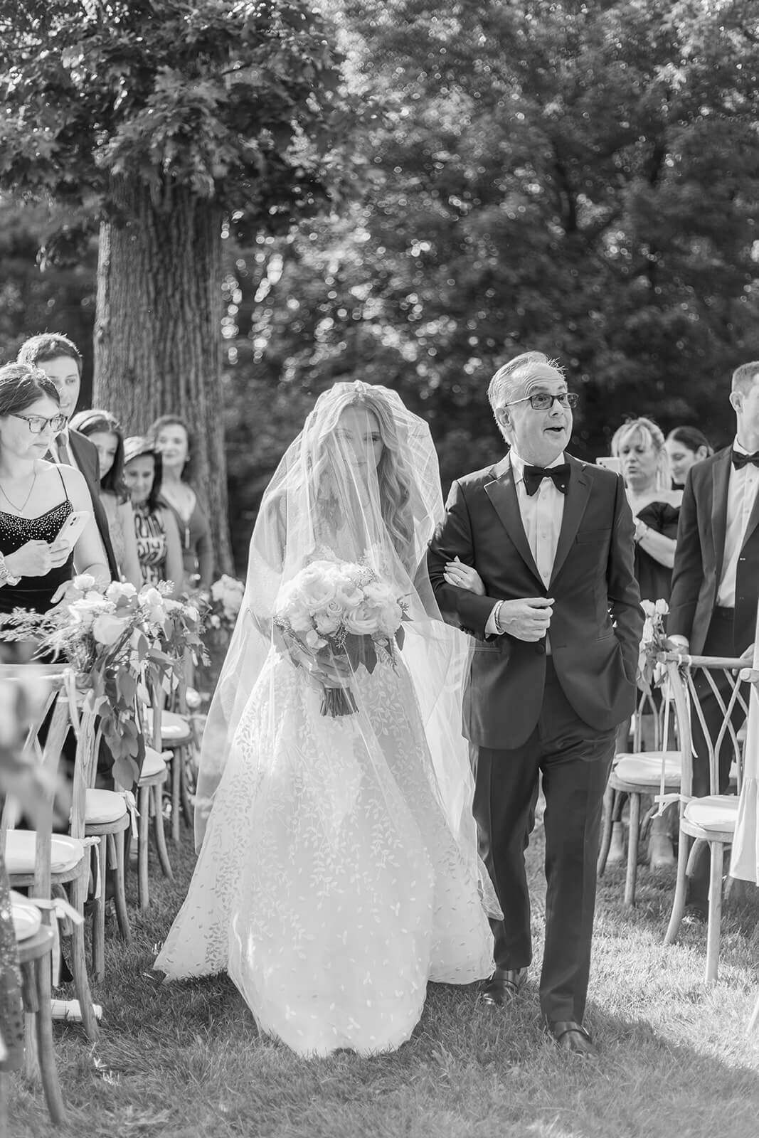 Bride walking down the aisle at Long Island wedding