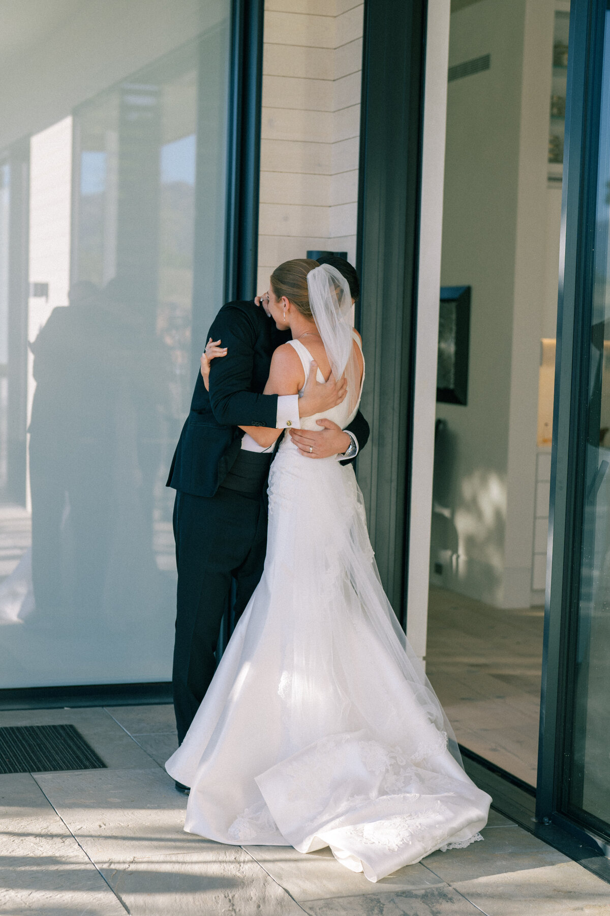 Bride and groom embrace after ceremony