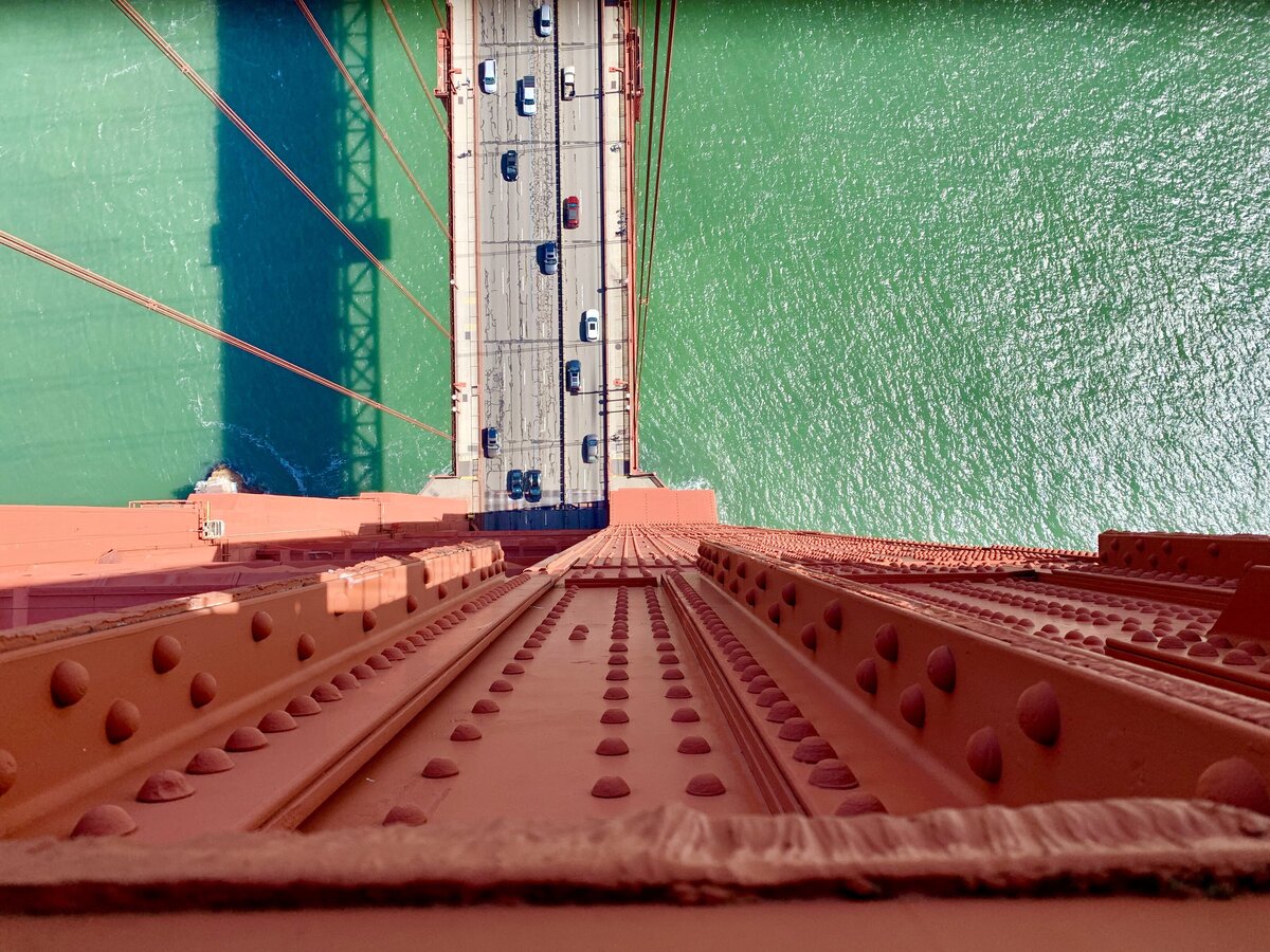View looking straight down to the water from the top of the golden gate bridge