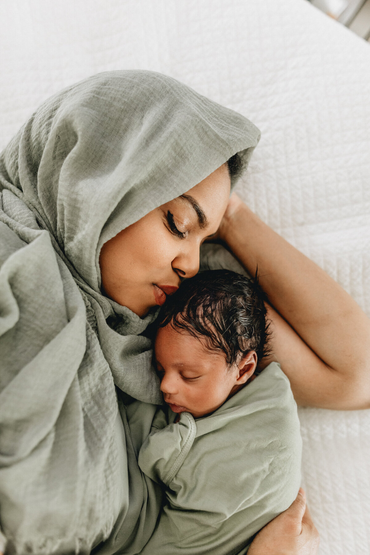 Mom holding new born baby.