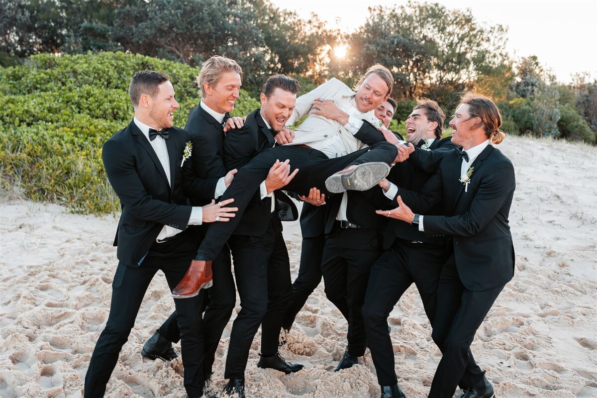 Luke together with the groomsmen are having a fun photoshoot!