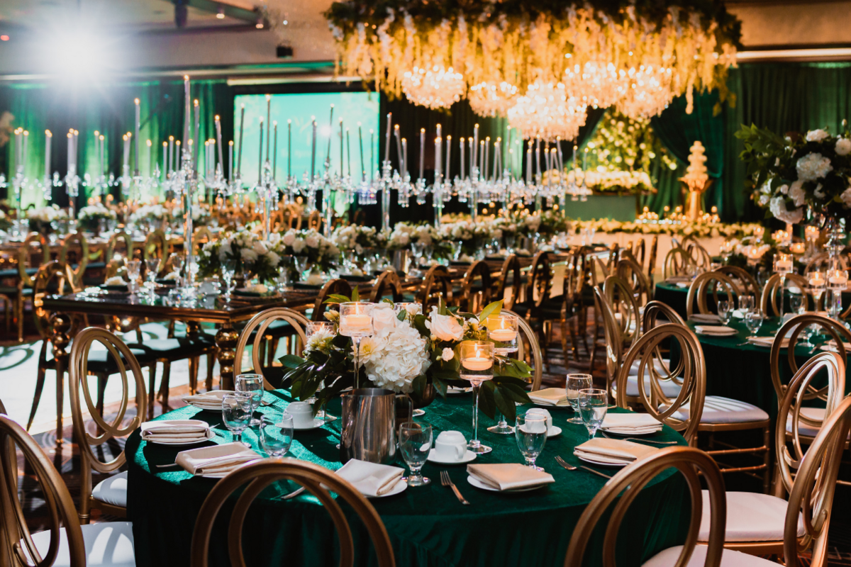 emerald-green-gold-luxury-reception-ceiling-chandeliers-greenery-flowers-candelabras