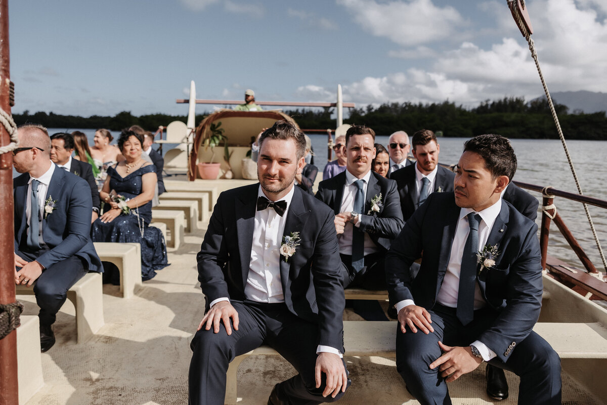 Men in tuxedo riding Kualoa Ranch boat