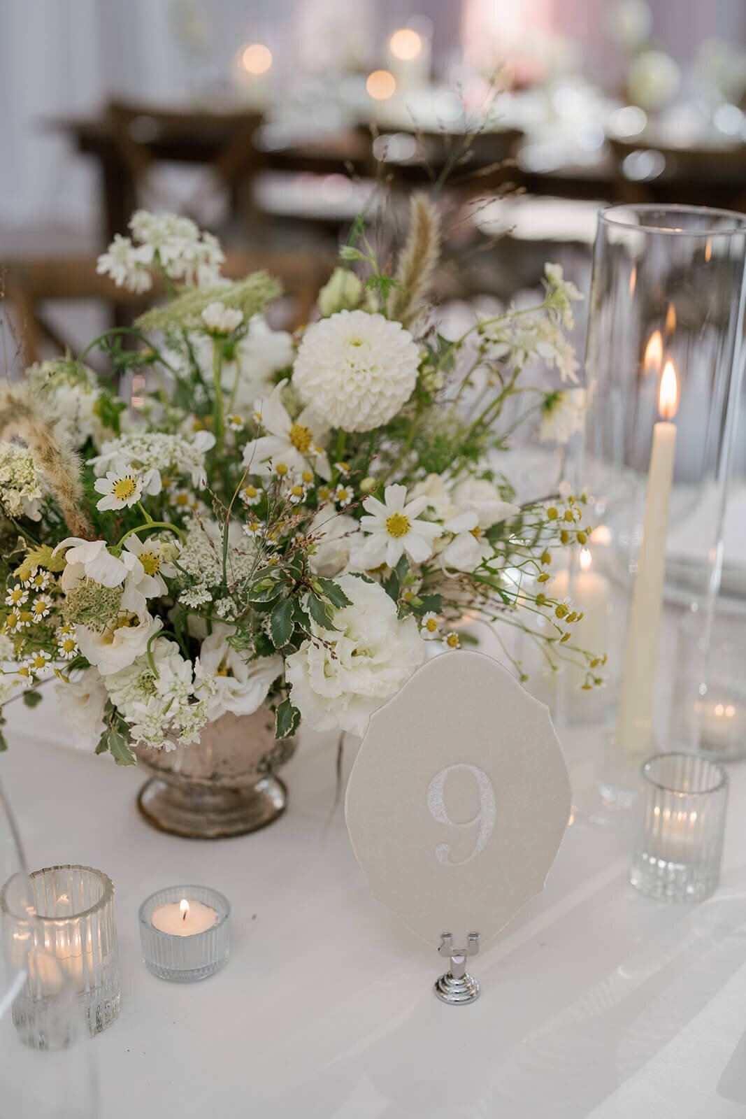 A velvet table number adorns the dinner table at an Aspen Meadows Resort wedding reception venue.