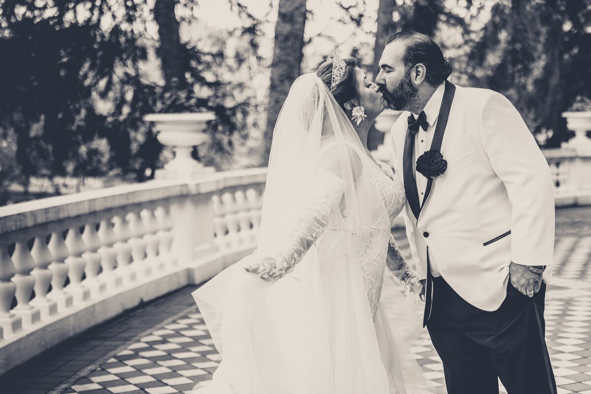 This stunning portrait captures Maria and Pete in a moment of serene affection, set against the luxurious backdrop of West Baden Springs Resort, showcasing their elegant wedding attire and the breathtaking architecture.