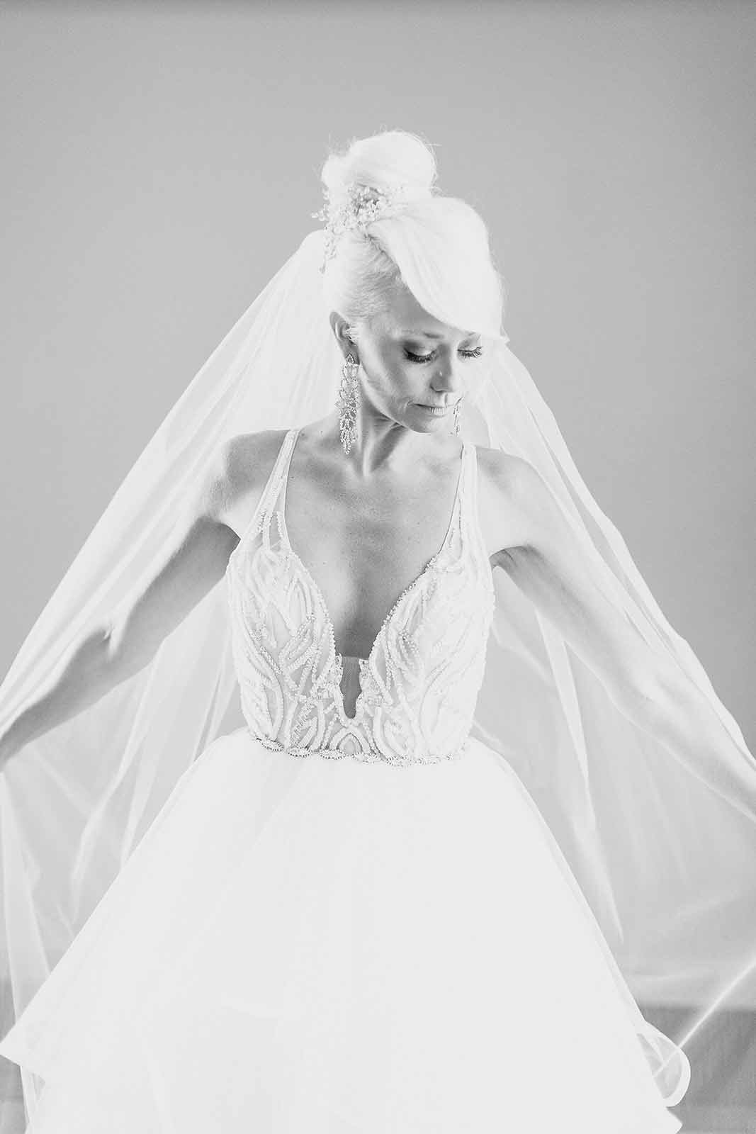 black and white photo of bride in long vail