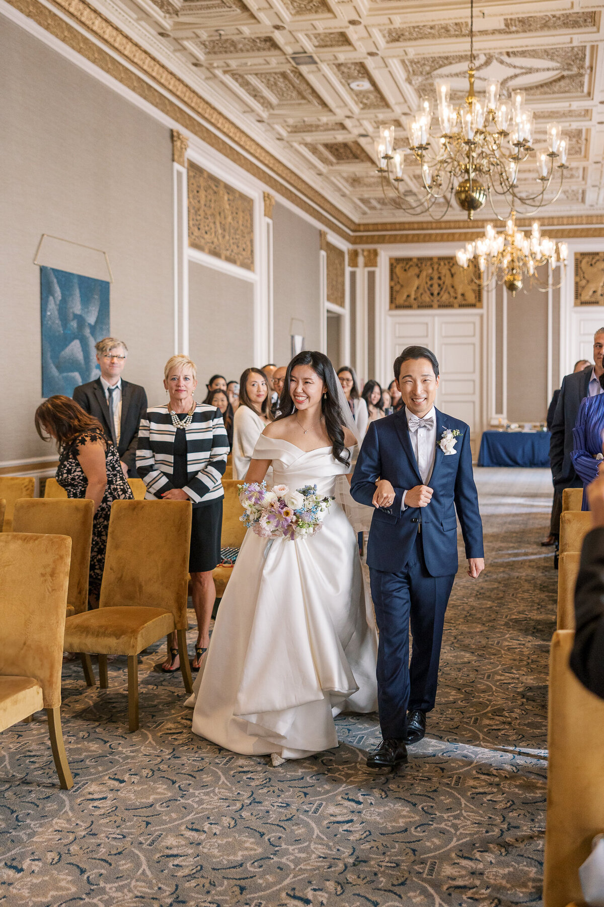 Processional bride and groom wedding ceremony at hotel venue