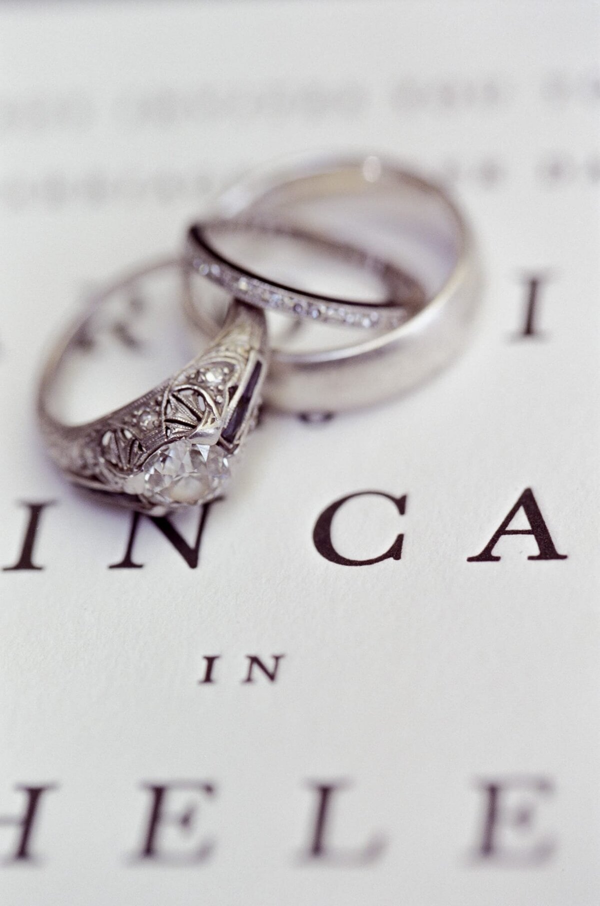 Close-up view of perfectly designed diamond rings place on a wedding card canvas.