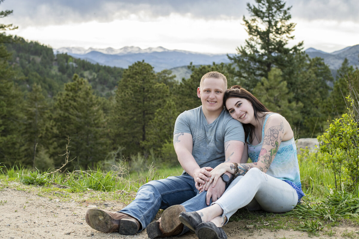 Couples session in Golden Colorado with blue and girls with tattoos with mountain view