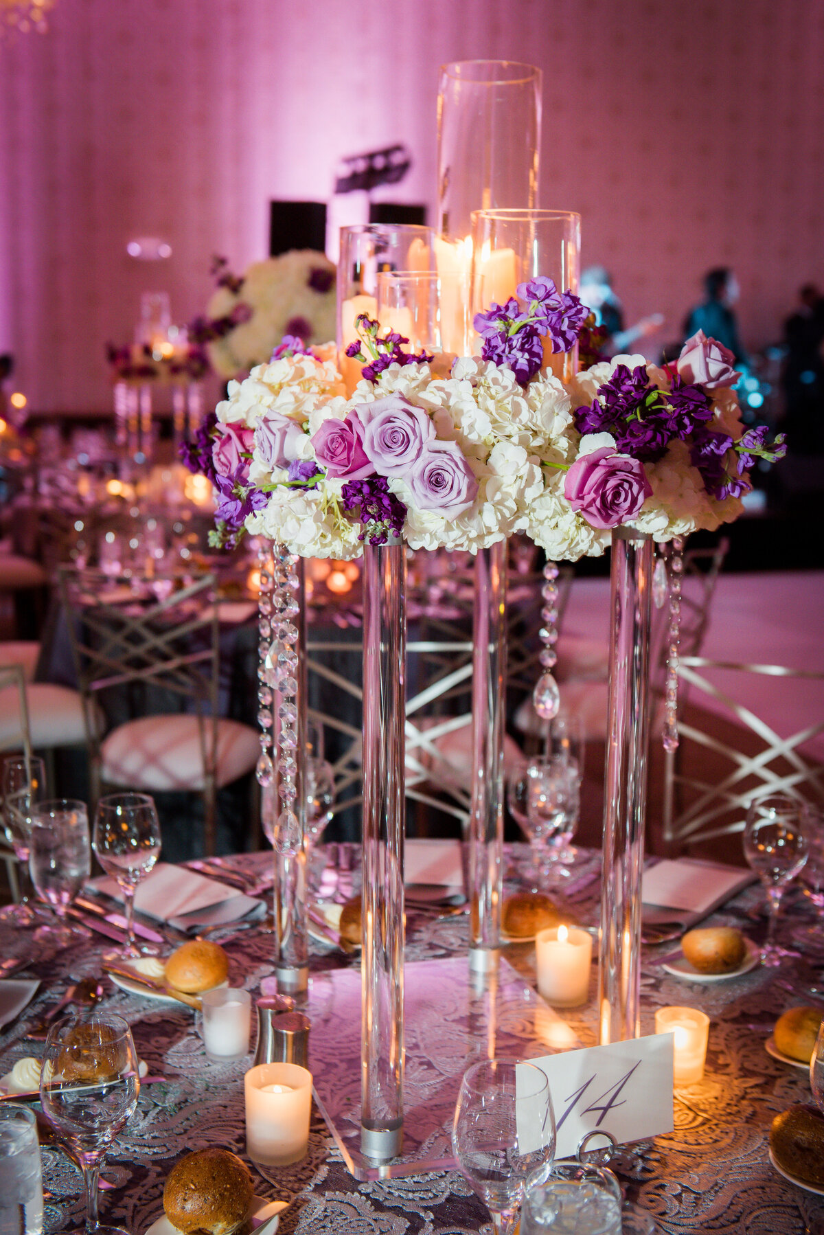 purple and white flowers wedding reception