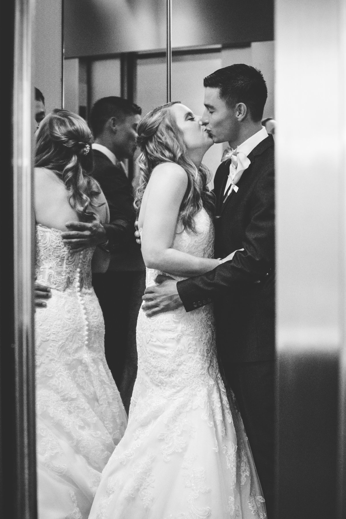 w austin hotel wedding photographer bride groom elevator kiss 200 Lavaca St, Austin, TX 78701