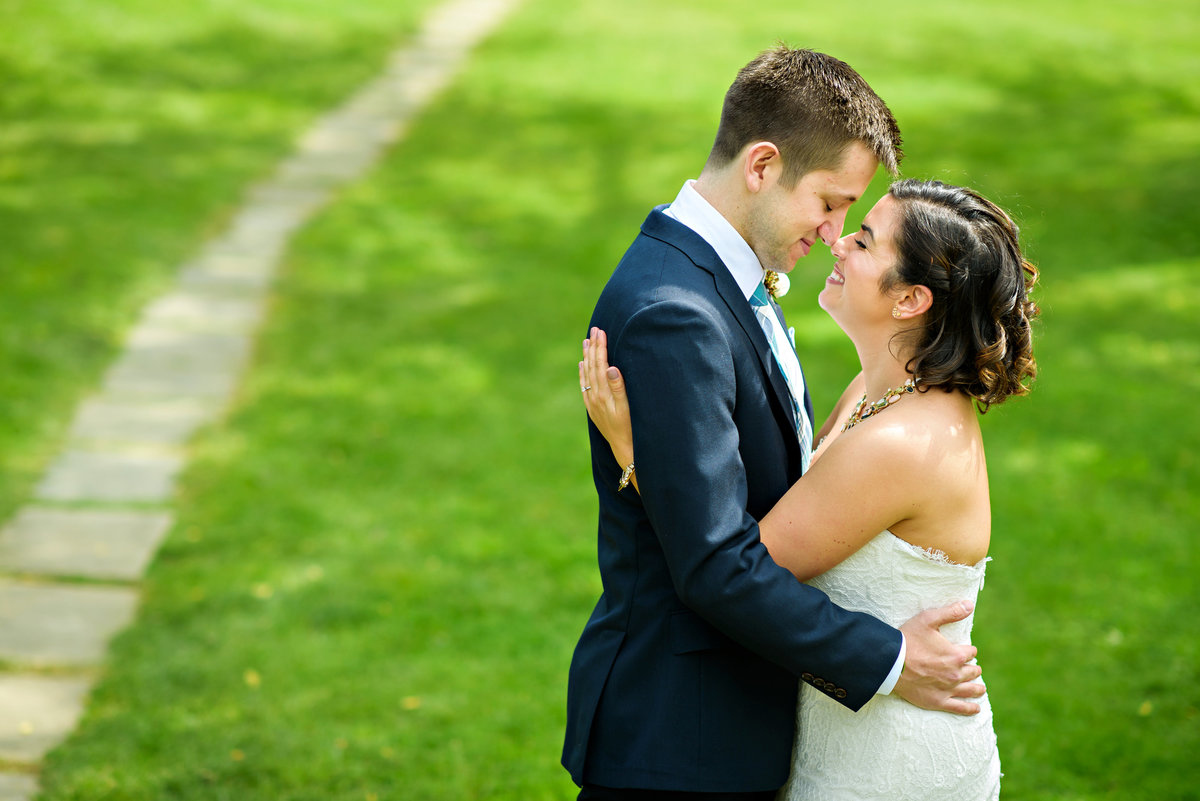A groom hugs his bride before their ceremony at  Anthony Wayne House.