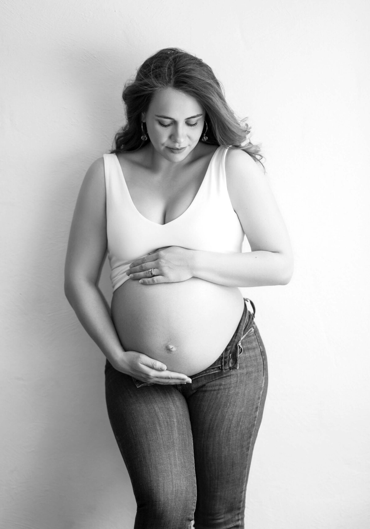 Minimalist maternity portrait in natural light.