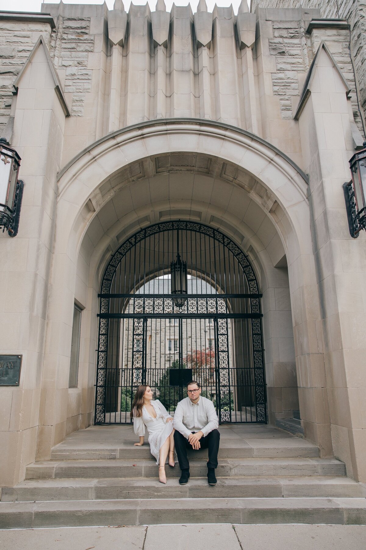 Engaged couple posing for photos at Western University for their engagement session by NovaMarkina Photography