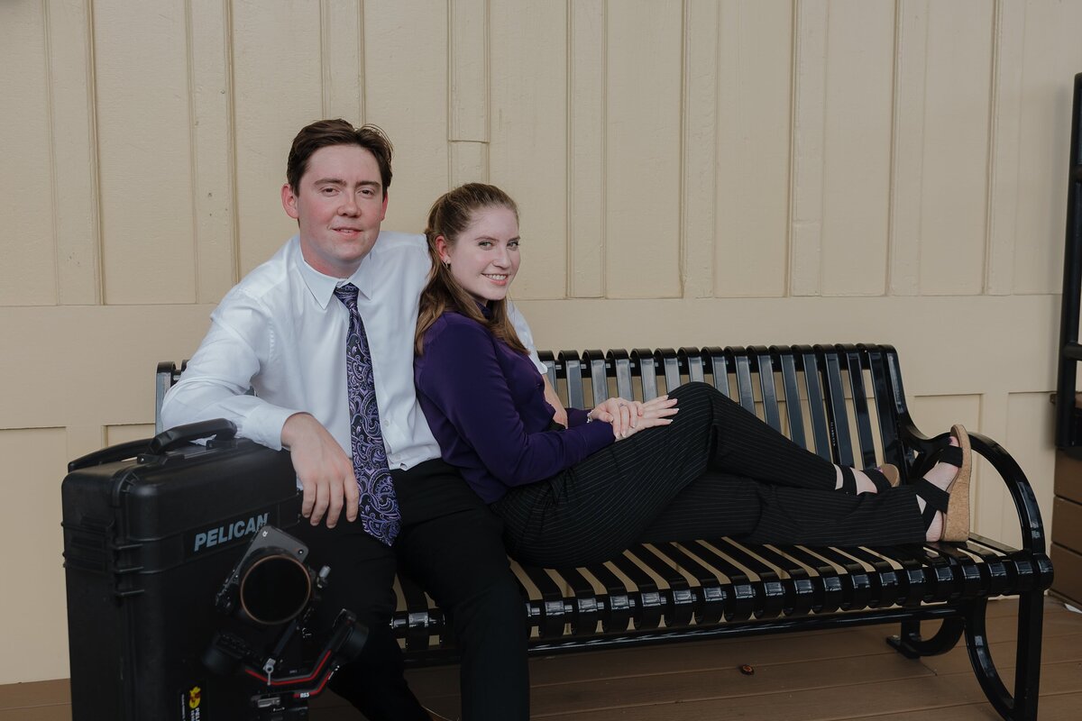 Wedding Photographer and Videographer posing together at The Depot in downtown Kennesaw.