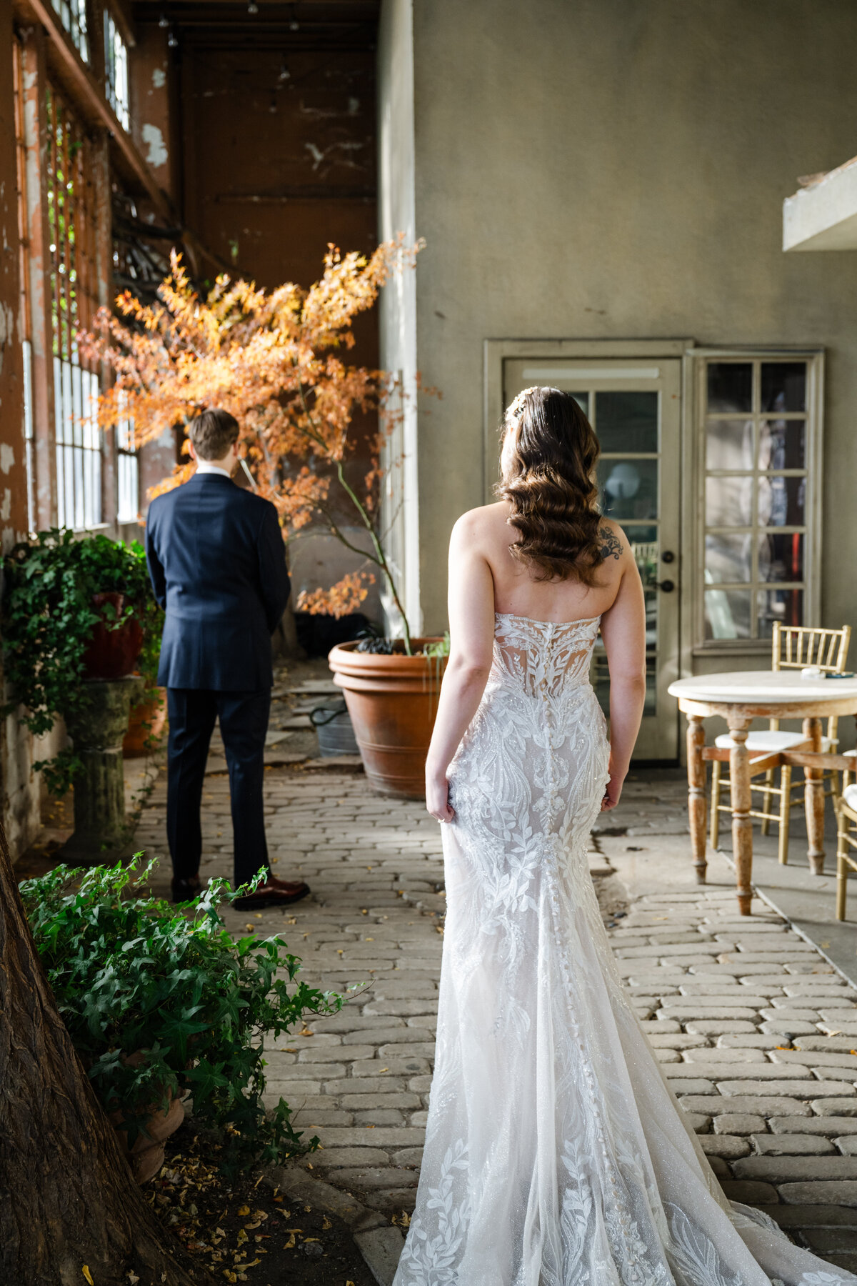 bride and groom first look indoors at the ruins venue seattle
