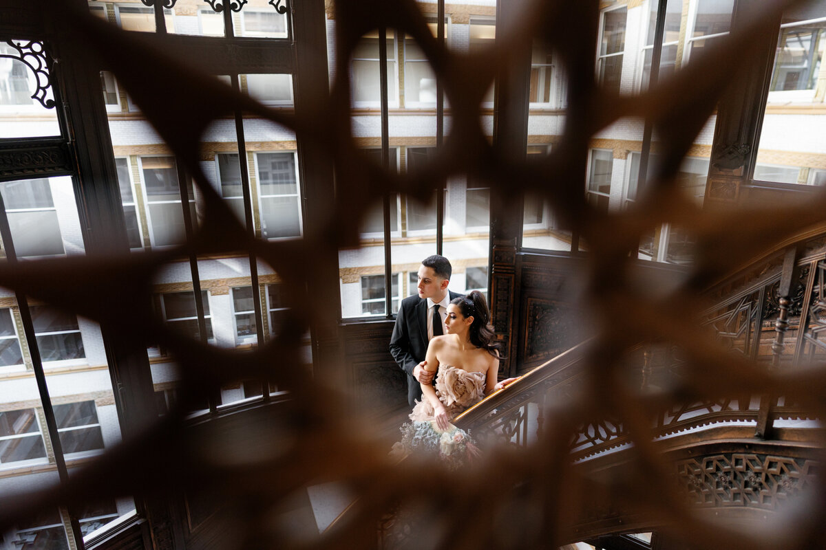 Aspen-Avenue-Chicago-Wedding-Photographer-Rookery-Engagement-Session-Histoircal-Stairs-Moody-Dramatic-Magazine-Unique-Gown-Stemming-From-Love-Emily-Rae-Bridal-Hair-FAV-25