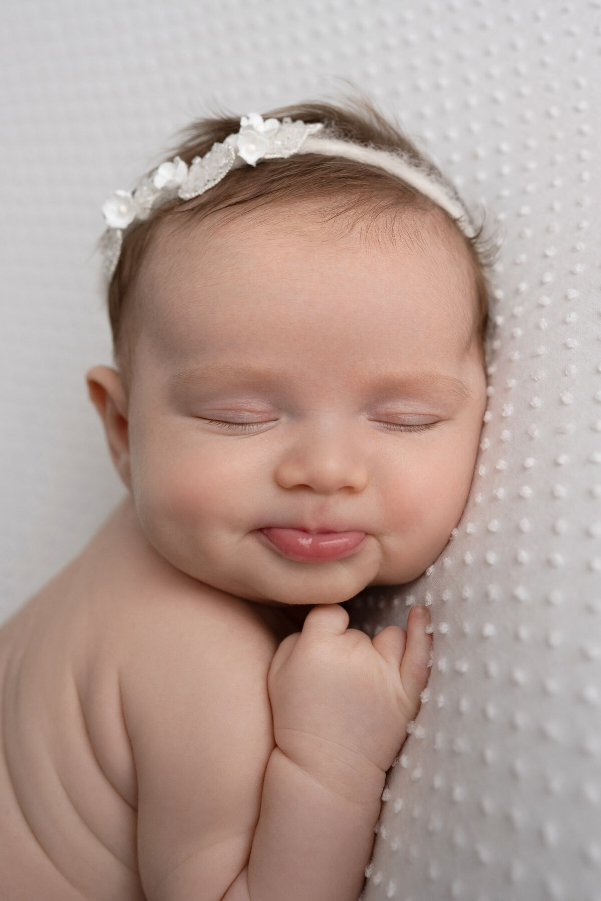 Newborn baby white headband close up Round Rock professional photographer