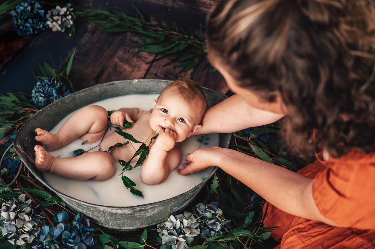 baby boy in milkbath