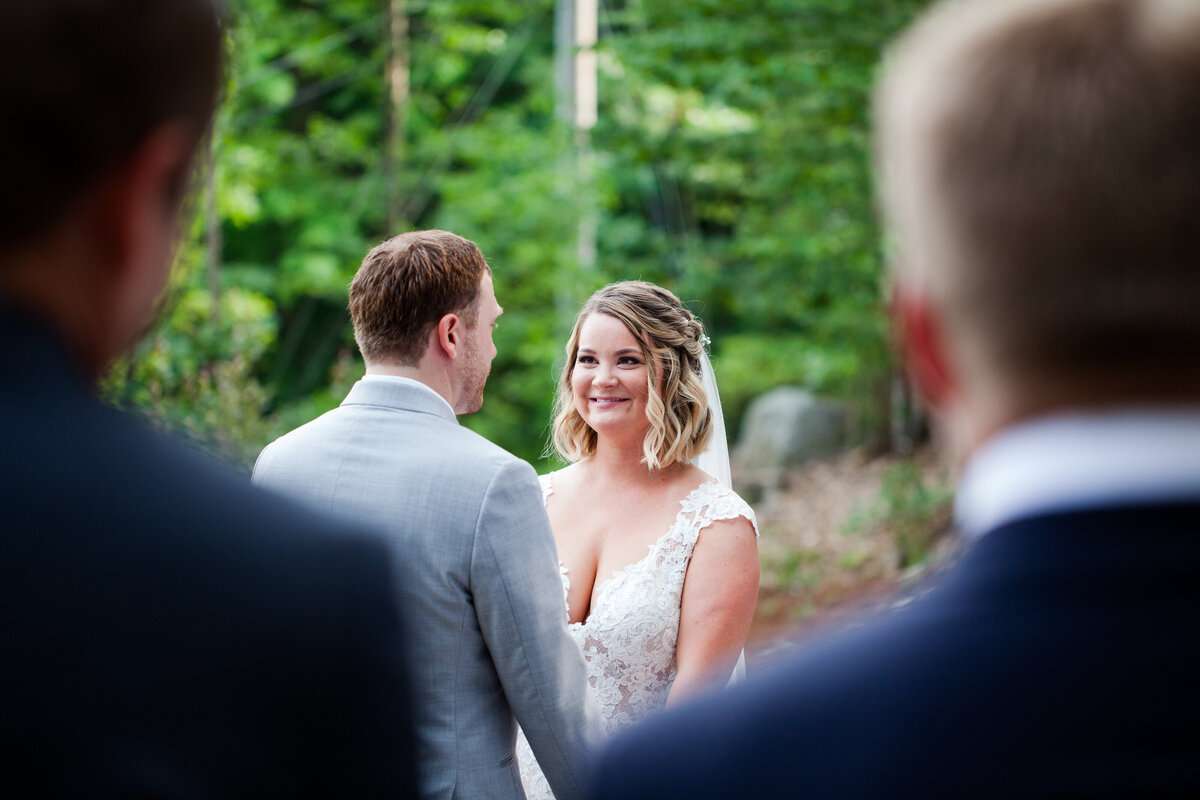Bride and Groom smiling at each other during vows