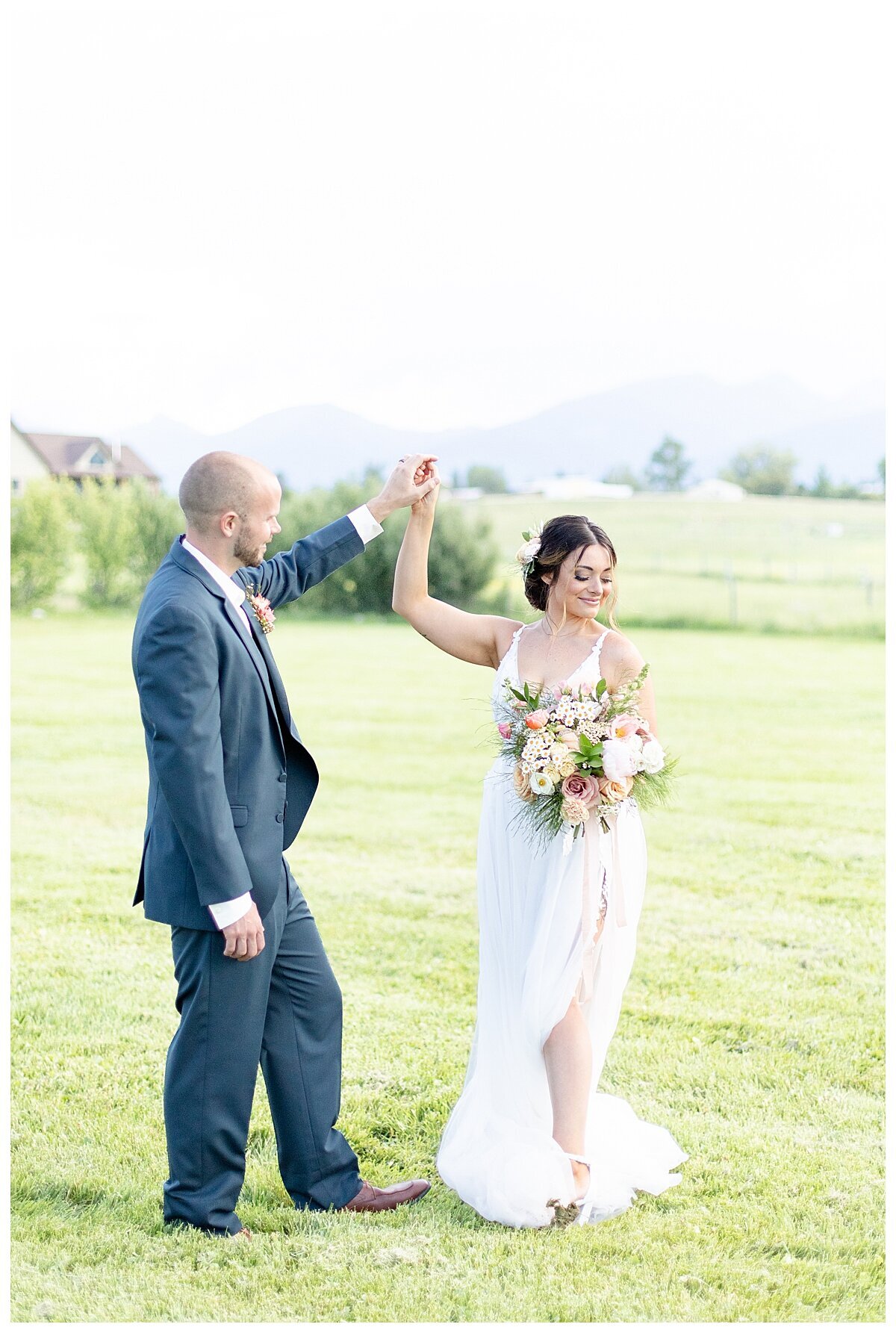 Luxury ranch elopement in Montana with couple dancing in field