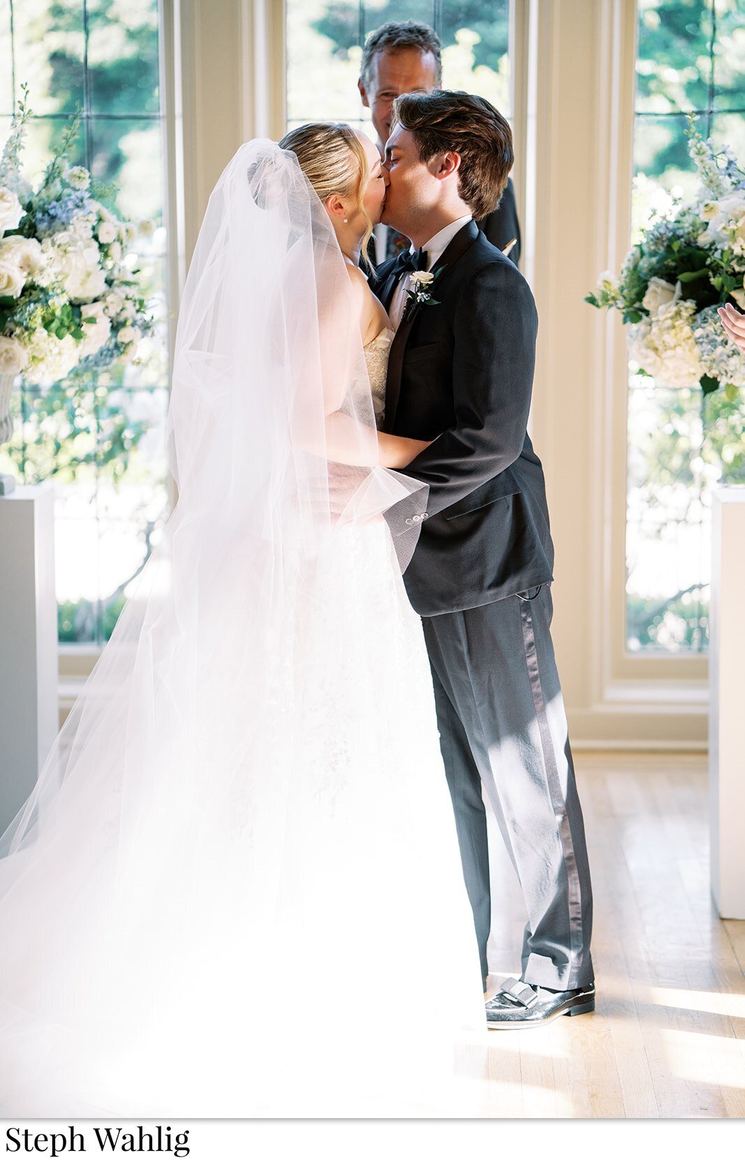bride, groom, flowers, first kiss, veils, 