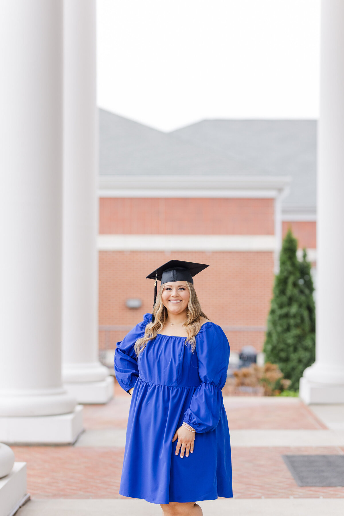 college senior posing in a blue dress at Lee University in Cleveland, TN