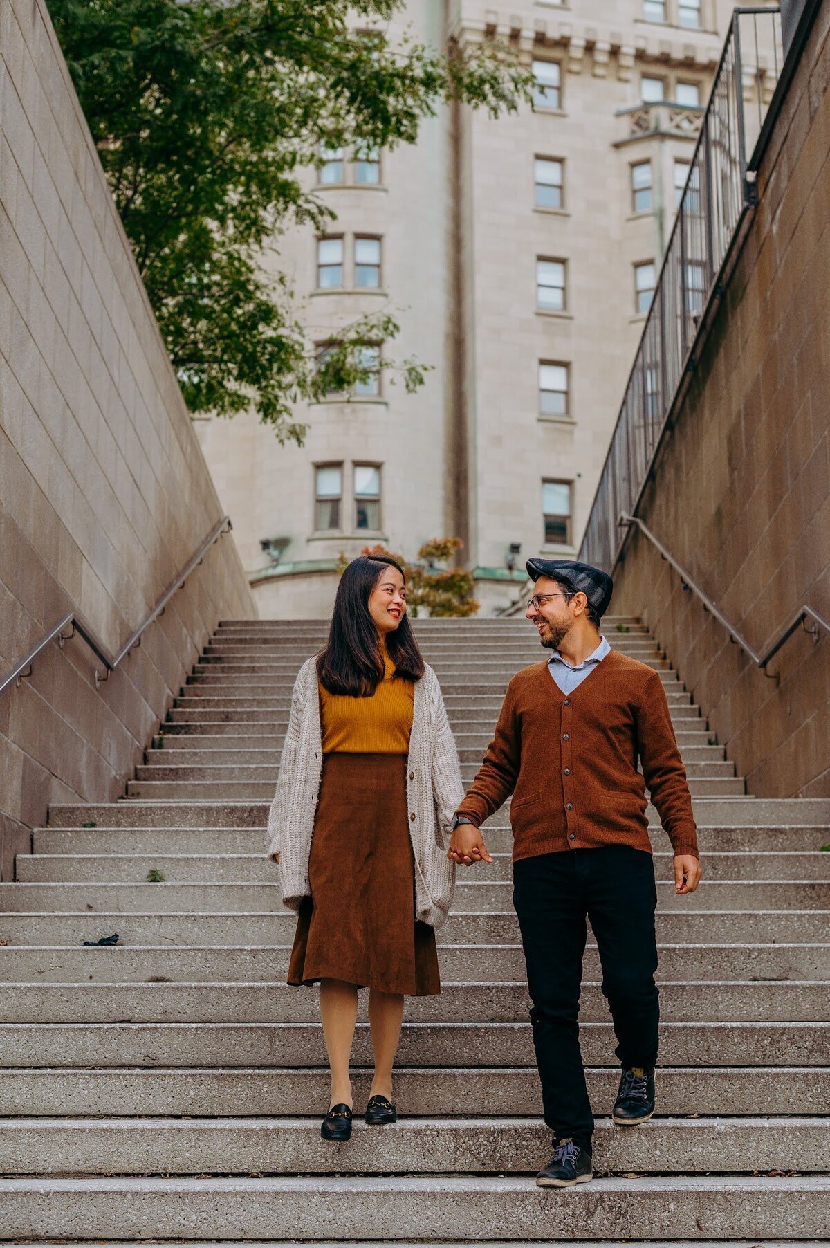 Couple walking through a downtown Ottawa alleyway during fall mini session.