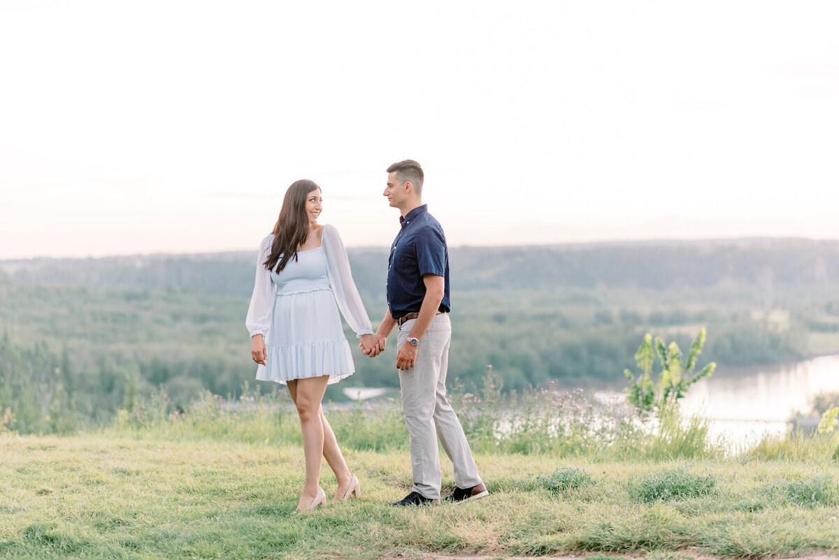 Gorgeous engagement portrait inspiration,  couple walking along a hillside of Edmonton, Alberta.