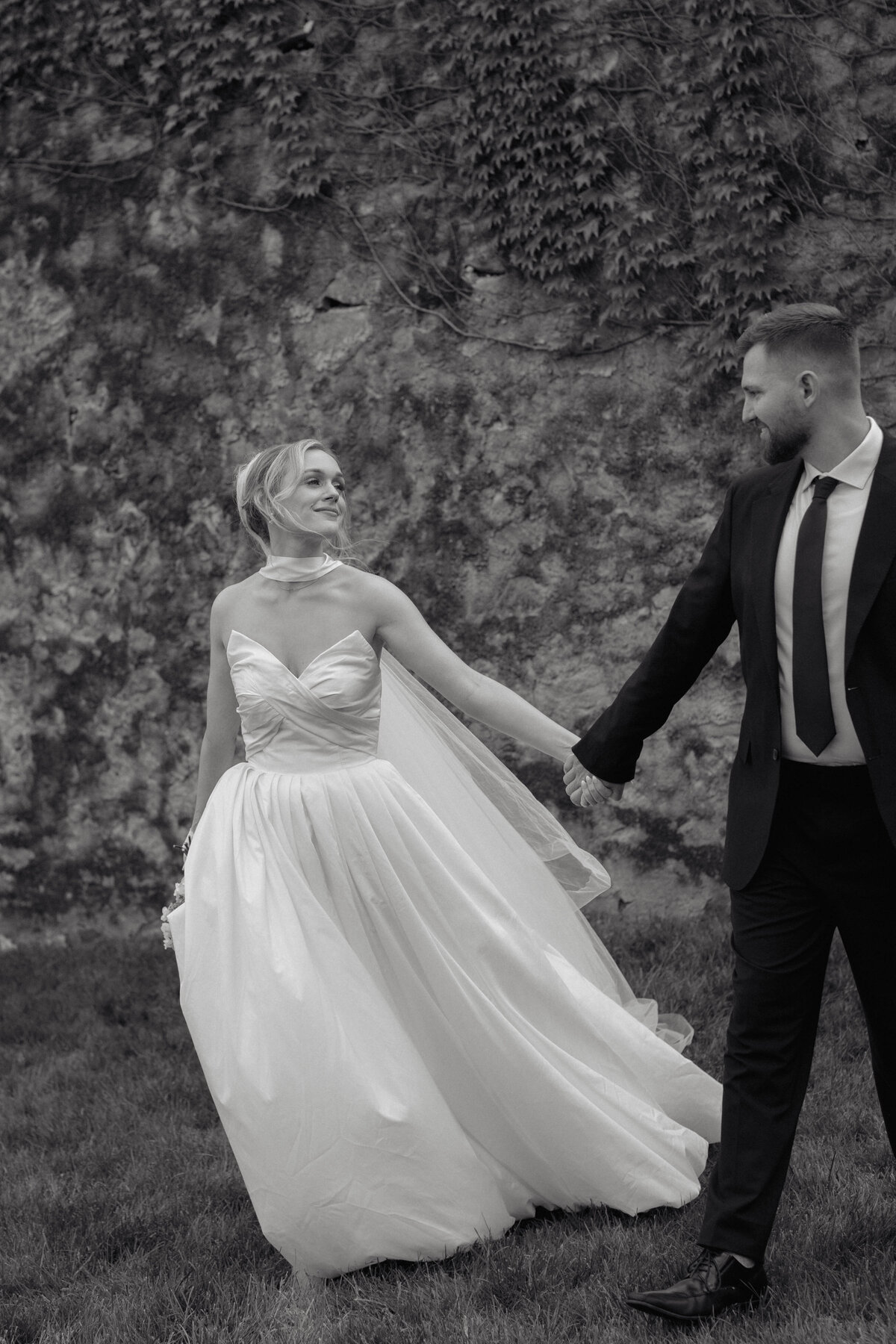 Artistic and intimate wedding photo capturing a candid moment between the couple, documented with elegance by luxury wedding photographers.