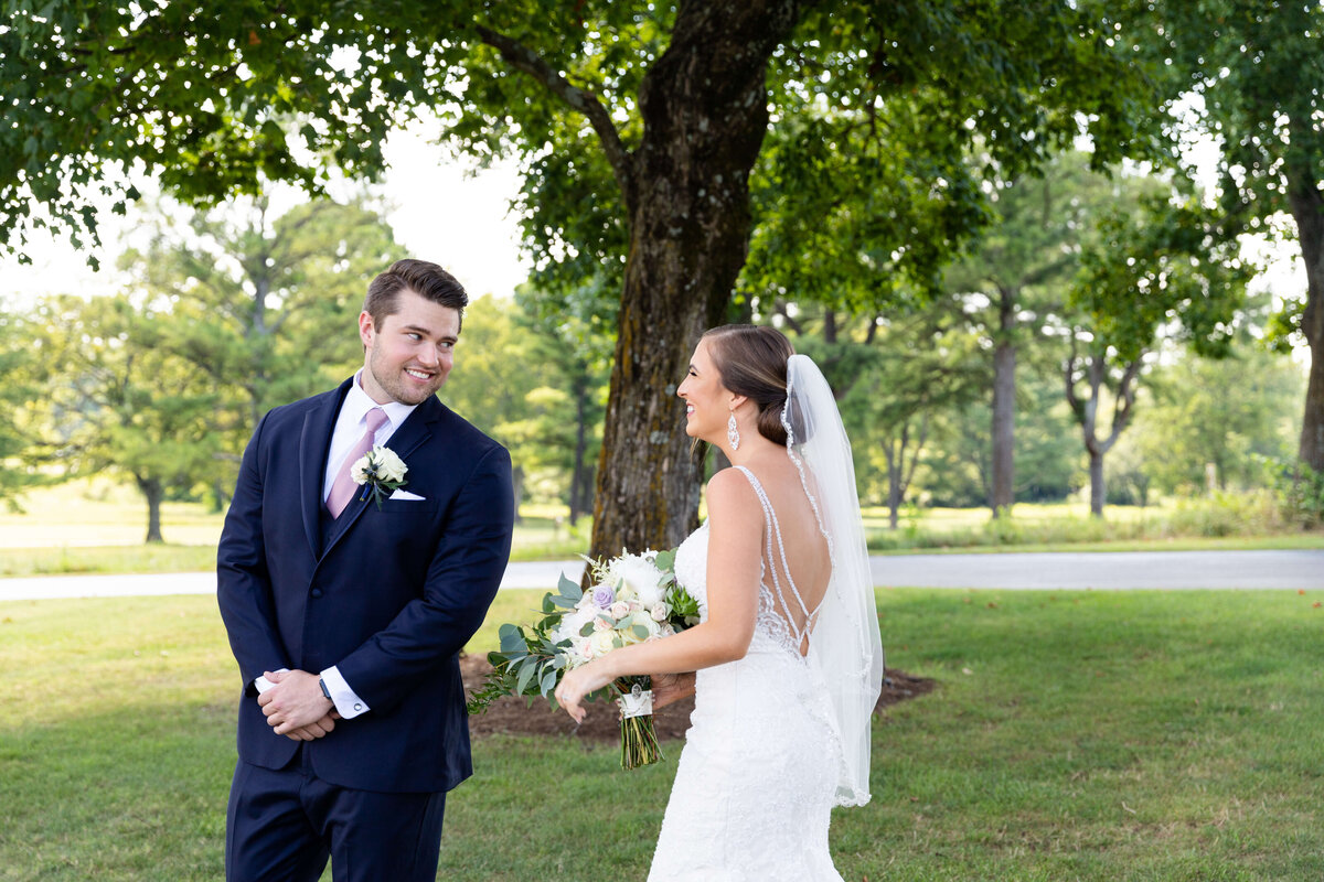 Bride and groom first looks at wedding at Stones River Country Club