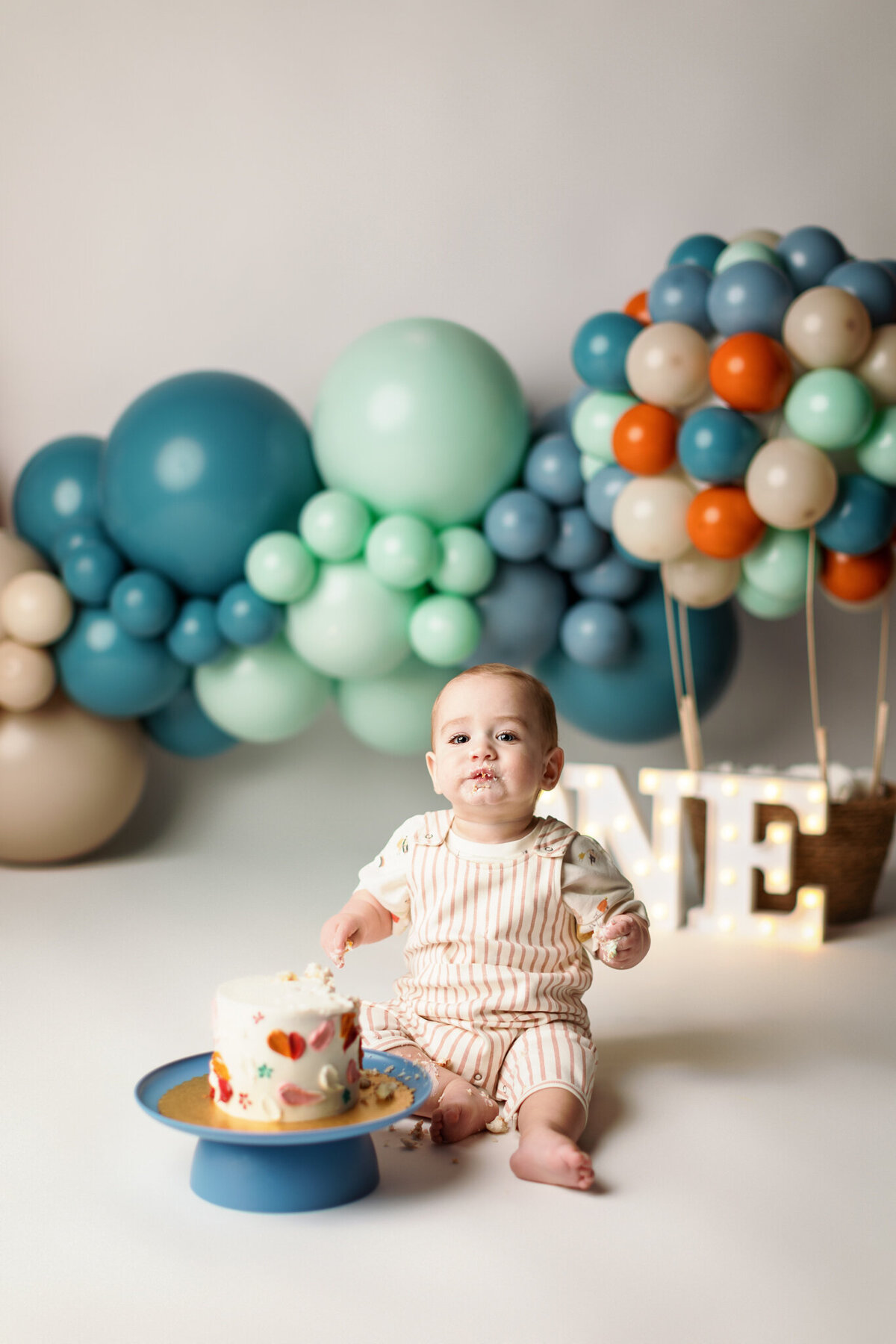 NWA cake smash photographer, milestone portrait session, baby birthday photoshoot Northwest Arkansas, best cake smash photography near me Fayetteville AR