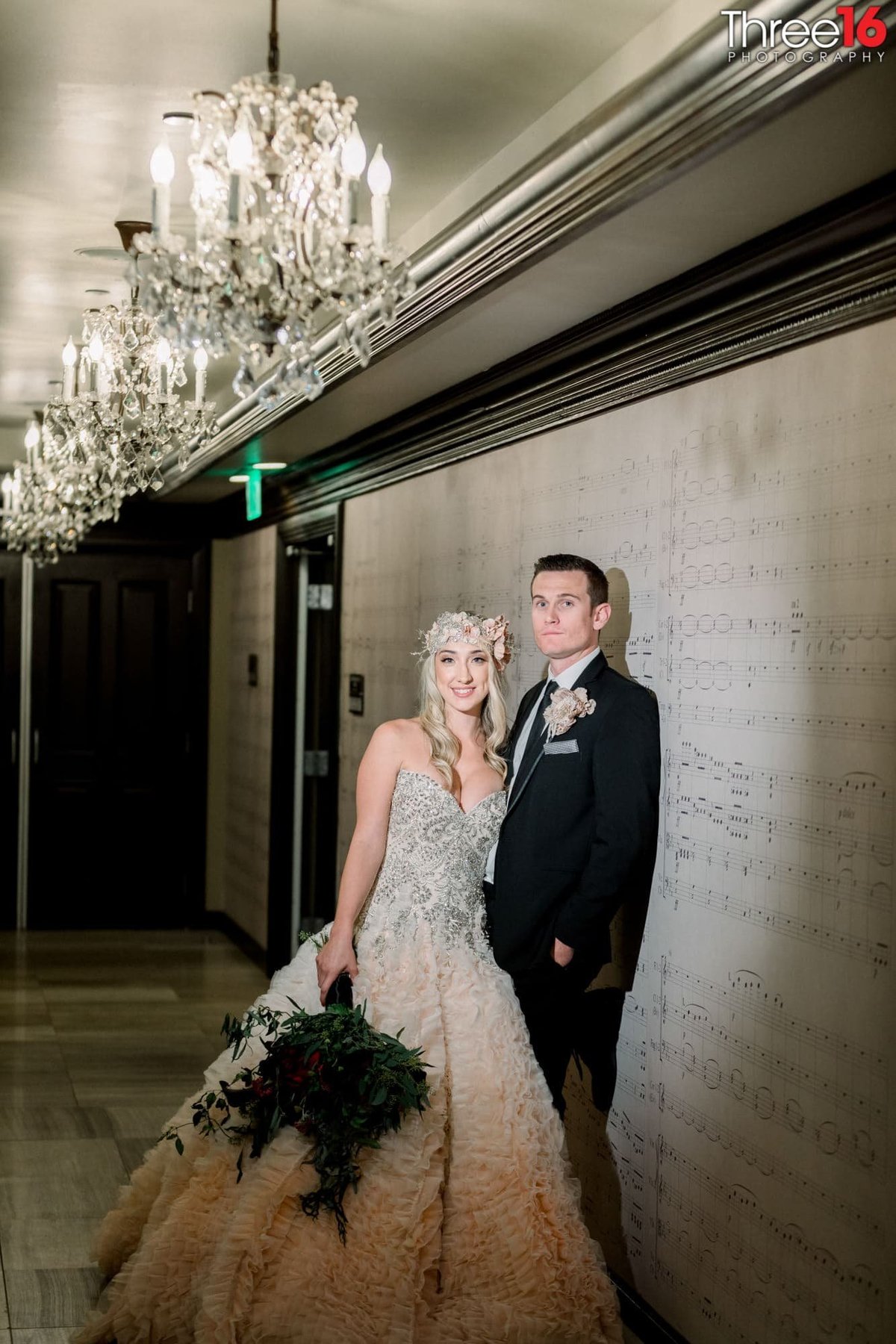 Bride and Groom pose for photos in the hallway at the Center Club Orange County